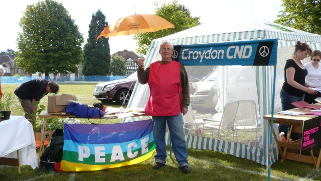 Jim Clugston with umbrella and tabard