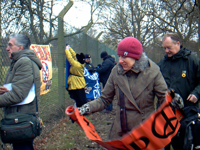 Jill unfolding orange banner